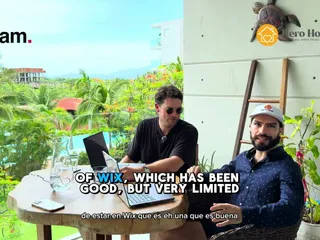 Kevin and the Hero Host team on a balcony overlooking Ixtapa-Zihuatanejo, recording the walkthrough video